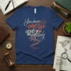 Quote "You have only one life use it wisely" on a navy t-shirt with a book and path graphic
