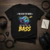 T-shirt with "You Hear The Music But You Feel The Bass" text and a purple bass guitar graphic with musical