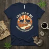 Navy t-shirt with "You Know Me Always Pussyfooting Around" text and two cats walking on a brick path, vintage sunburst
