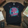 Black t-shirt with bold pink and turquoise text reading "YOU NEED TO LEAVE" inside a circular graphic