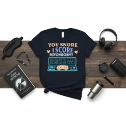 Navy t-shirt with "You Snore I Score Polysomnography" text and a graphic of a polysomnography machine with a sleeping mask