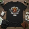 Young Wild & Reckless lion graphic with wings and motorcycle on a black t-shirt, bold typography