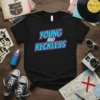 Black t-shirt with bold blue and pink "Young and Reckless" text graphic