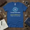 Blue t-shirt with white and teal atom graphic and the quote "Your body is made of atoms between 4.5 &