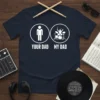 Your Dad My Dad t-shirt design with stick figure dad and drummer graphic, white text on navy blue shirt