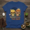 Graphic t-shirt design featuring two skulls with the text "Your Ego Is Amigo Your Amigo" and a crown on one