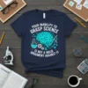 Your Inability to Grasp Science quote with a teal brain graphic on a navy t-shirt, science symbols, and scientific equipment