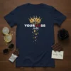 Your Loss, Babe. quote t-shirt with a cracked crown graphic and falling gold accents. Navy tee with white and red
