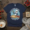 Graphic t-shirt with the quote "You're Doing Okayer Than You Think" featuring a badger chef rolling dough and a pie