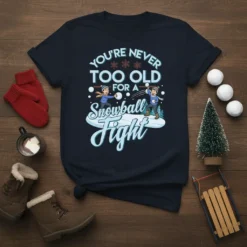 You're Never Too Old For A Snowball Fight T-Shirt with cartoon kids throwing snowballs, snowflakes, and festive winter theme