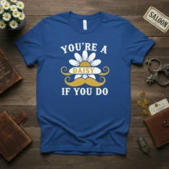 Blue t-shirt with white text "You're a Daisy If You Do" and a yellow mustache with a daisy graphic in
