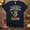 T-shirt with text "You've Just Buttered Your Last Biscuit Partner" above a cowboy badger character holding a biscuit