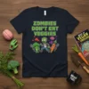 Zombies Don't Eat Veggies funny quote on a navy t-shirt with cartoon zombie, broccoli, and carrot characters