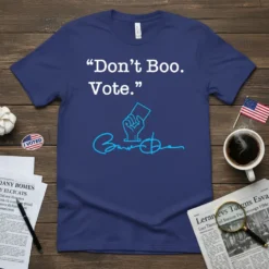 "Don't Boo. Vote." quote on a navy blue t-shirt with a graphic of a hand holding a ballot and a