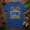¡Felicidades! ¡Paranda! design with dancing figures, palm trees, and campfire on a blue t-shirt
