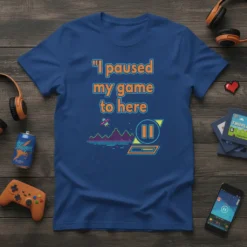 T-shirt with quote "I paused my game to here" and retro video game graphic with pause button