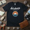 Öland County of Sweden t-shirt with a wind turbine and sunset graphic, representing Swedish coastal travel