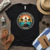 Vintage Île de Porquerolles France t-shirt design with a lighthouse, palm trees, and ocean sunset graphic