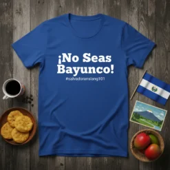 Blue t-shirt with white text ¡No Seas Bayunco! and #salvadoranslang101, featuring El Salvador flag and volcano graphic