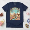 #SNACK GOALS t-shirt design featuring ice cream cones, donuts, popcorn, and hot air balloons in a whimsical landscape