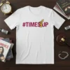 White t-shirt featuring the "#TIMESUP" slogan in maroon text with a raised fist graphic