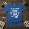 Blue t-shirt with white text "'Tis The Season To Remind Everyone That I'm Jewish" and Hanukkah graphics like menorahs and