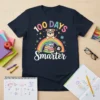 100 Days Smarter t-shirt design with a cartoon dog wearing glasses, a rainbow, and a stack of books