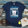 Navy blue t-shirt with the text "BE THE PERSON YOUR DOG THINKS YOU ARE" and a graphic of a smiling