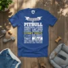 Blue t-shirt with bold white and yellow text detailing pitbull characteristics: "Beware of Pitbull Aggressive Licking Sloppy Lap Dog Kissing