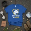 Blue t-shirt with white and yellow "Don't Bully My Breed" text and pitbull graphic inside a shield