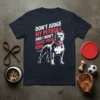 Don't Judge My Pitbull And I Won't Judge Your Kids quote with a pitbull dog illustration on a navy t-shirt