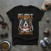 Don't Judge My Pitbull And I Won't Judge Your Kids quote on a black t-shirt with a Pitbull dog graphic