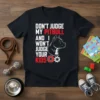 Don't Judge My Pitbull And I Won't Judge Your Kids quote on a black t-shirt with a pitbull graphic and