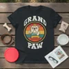 Grand Paw t-shirt featuring a vintage style bulldog wearing a crown and holding dog bones, with the words GRAND PAW