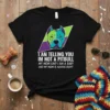 I Am Telling You Im Not A Pitbull quote with a colorful pitbull graphic on a black t-shirt