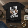 I LOVE PITBULLS heart graphic t-shirt featuring a collection of pitbull dog faces in white distressed text and illustration