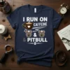 I Run On Caffeine & Pitbull text with coffee cup and two pitbull faces design on a navy t-shirt