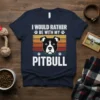 Navy t-shirt with vintage sunset stripes and text "I Would Rather Be With My Pitbull" above a pitbull dog face