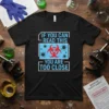 Black t-shirt with "IF YOU CAN READ THIS YOU ARE TOO CLOSE" text and a biohazard symbol surrounded by virus