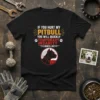 If You Hurt My Pitbull quote on a black t-shirt, featuring a graphic of a pitbull's head. Includes paw prints