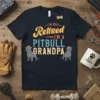 I'm Not Retired I'm A Pitbull Grandpa text with two pitbull graphics wearing crowns on a navy t-shirt