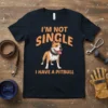 I'm Not Single I Have A Pitbull text with a cartoon pitbull graphic on a navy t-shirt