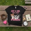 Black t-shirt with pink text "JUST A GIRL WHO LOVES Pitbulls" and three cartoon pitbull dogs