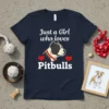 Just a Girl who loves Pitbulls text design with a Pitbull dog graphic and red hearts on a navy t-shirt