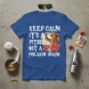 Keep Calm It's A Pitbull Not A Freakin' Shark quote on a blue t-shirt with a pitbull illustration and hearts