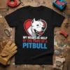 T-shirt design with text "MY HEART IS HELP BY THE PAWS OF A PITBULL" featuring a white Pitbull's head inside