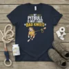 My Pitbull Is Why I Have Bad Knees t-shirt with a cartoon pitbull pulling on a leash, showing bandaged knees