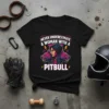 Never Underestimate A Woman With A Pitbull T-Shirt featuring a woman and two pitbull heads graphic