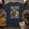 Never Underestimate An Old Man With A Pitbull t-shirt design featuring a vintage-style illustration of a man and his pitbull