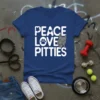 White text "PEACE LOVE PITTIES" with paw print and pitbull graphic on a navy blue v-neck t-shirt